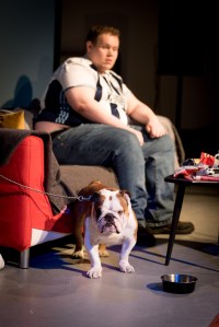 he man in the West Bromwich Albion shirt known as Bubble is sitting with dog